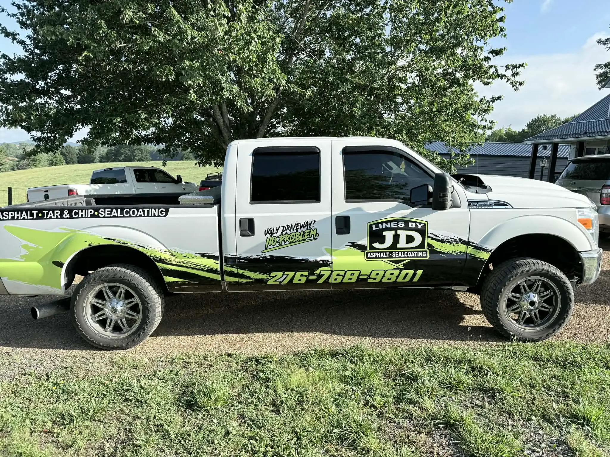 The Lines by JD truck, wrapped in the company's black and lime livery