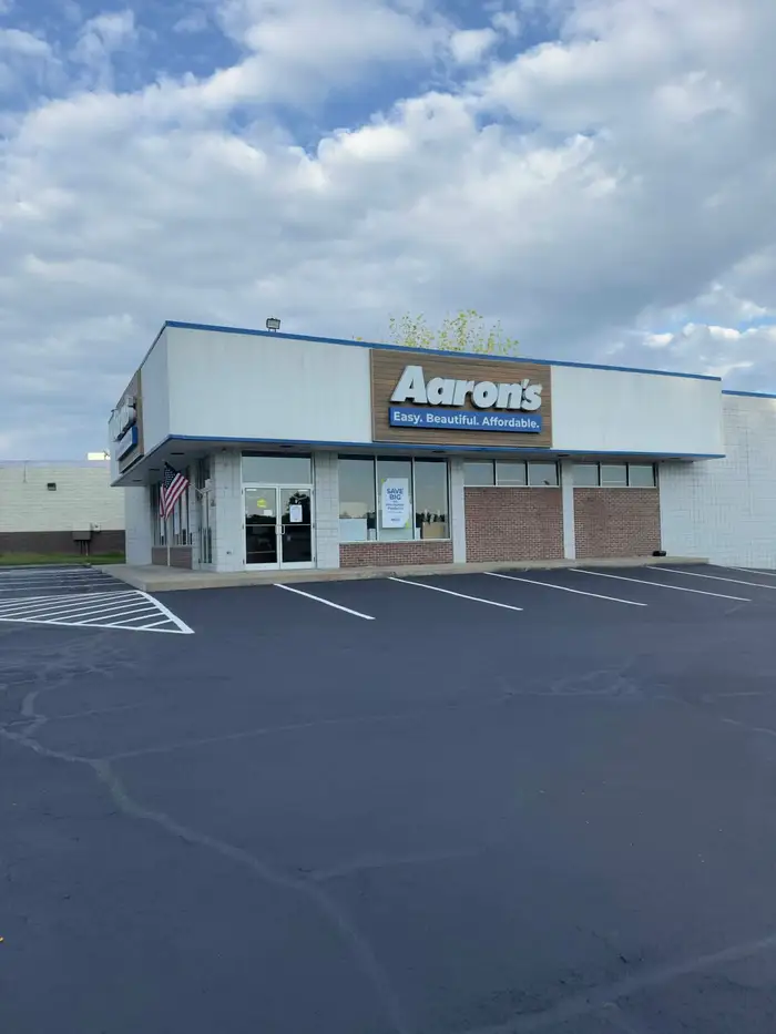Retail storefront parking lot resealed and re-striped with new stalls
